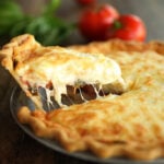 Serving a slice of tomato pie.