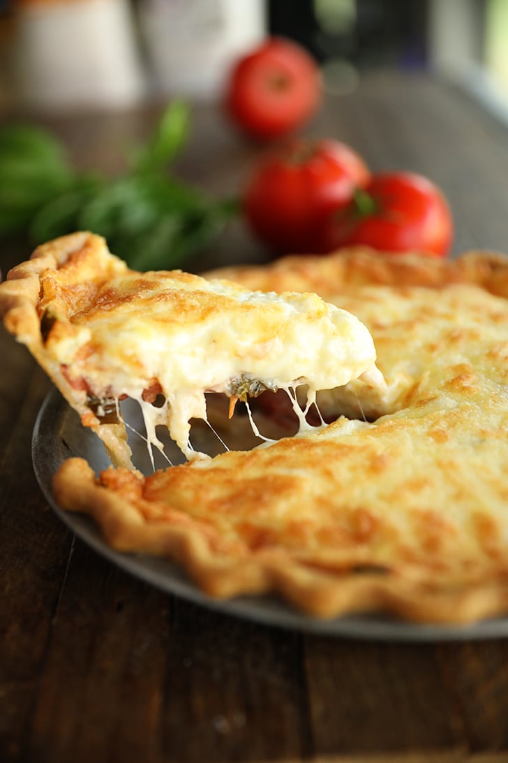Serving a slice of tomato pie.