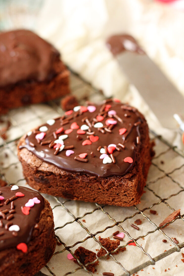 Heart-shaped brownies with chocolate ganache frosting.