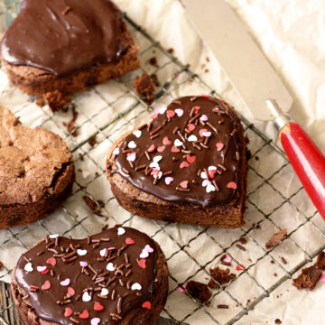 Heart-shaped brownies with chocolate ganache frosting.
