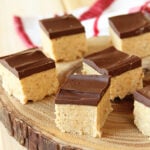 Peanut Butter Ball Bars on wooden platter.