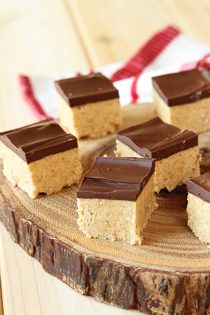 Peanut Butter Ball Bars on wooden platter.
