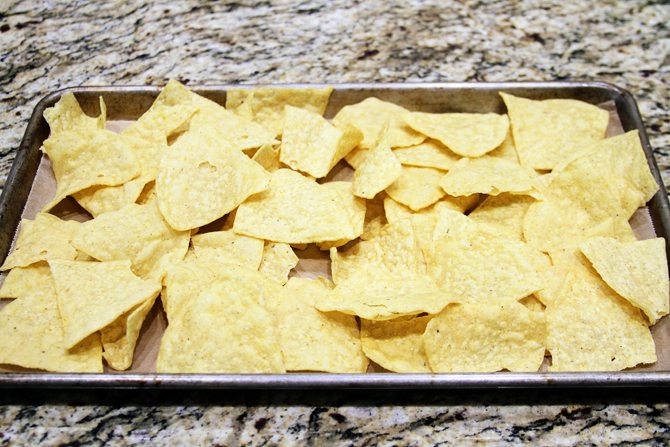 These Southern Sheet Pan Nachos combine smoky pulled pork, melty pimiento cheese, and all your favorite toppings into one amazing pan of food! 