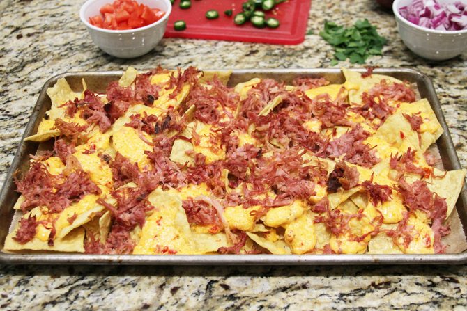 These Southern Sheet Pan Nachos combine smoky pulled pork, melty pimiento cheese, and all your favorite toppings into one amazing pan of food! 