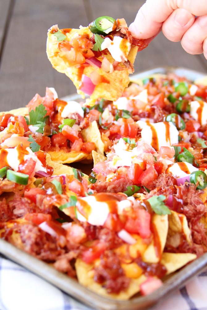 These Southern Sheet Pan Nachos combine smoky pulled pork, melty pimiento cheese, and all your favorite toppings into one amazing pan of food! 