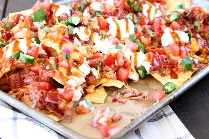 These Southern Sheet Pan Nachos combine smoky pulled pork, melty pimiento cheese, and all your favorite toppings into one amazing pan of food! 