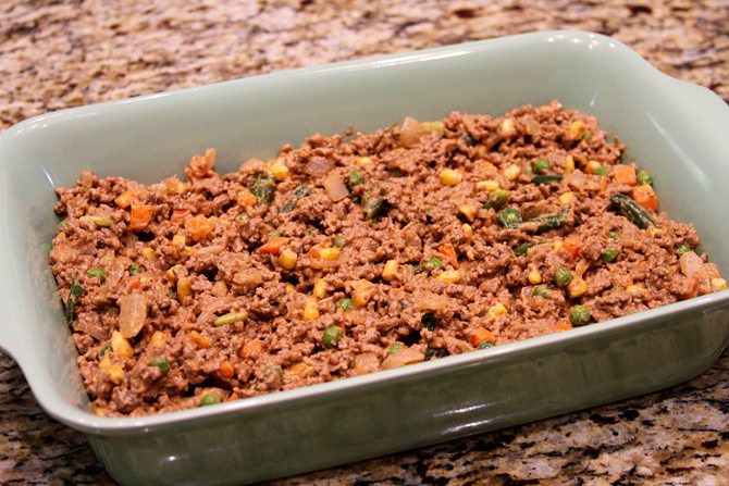 This Cheesy Beef Bake with Onion Rings is a delicious twist on the Classic Tater Tot Casserole!