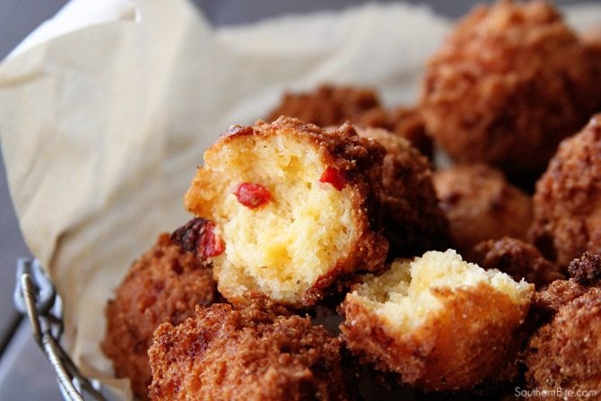 These Pimiento Cheese Hush Puppies need to be on your MUST MAKE list! The tangy pimiento and gooey cheese take the ordinary to extraordinary! 