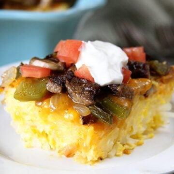 Cheese, eggs, steak, peppers, and onions combine in this Baked Big Steak Omelet!