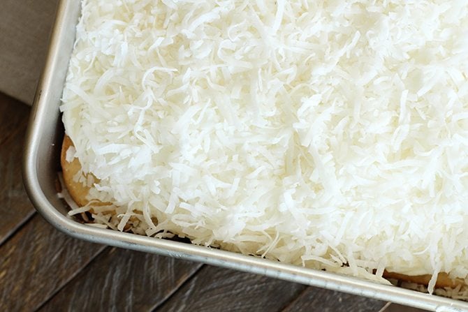  This Dreamy Coconut Sheet Cake starts out with a boxed cake mix but turns into something magical! 