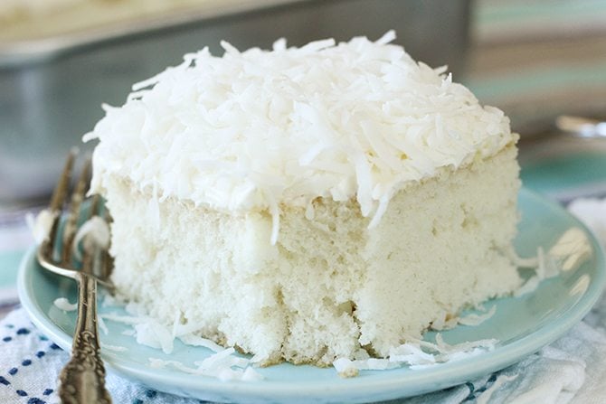  This Dreamy Coconut Sheet Cake starts out with a boxed cake mix but turns into something magical! 
