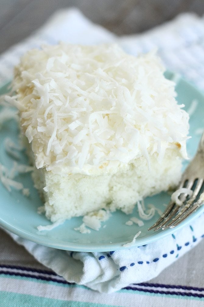  This Dreamy Coconut Sheet Cake starts out with a boxed cake mix but turns into something magical! 