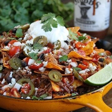 The Slow Cooker does all the hard work with these amazingly delicious LOADED Brisket Nachos!