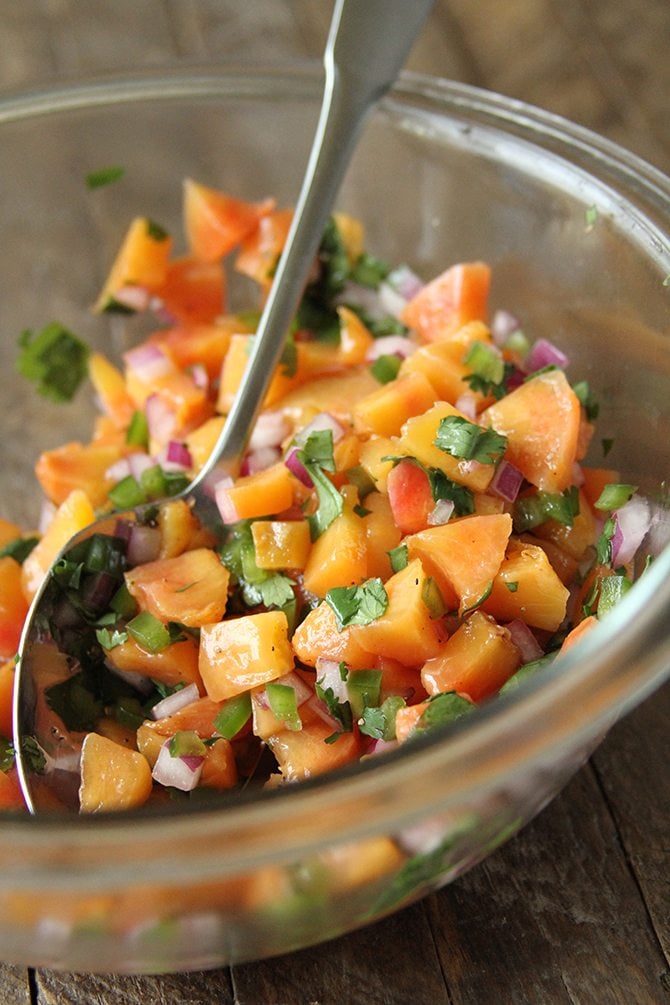 Top this sweet and sticky pork burger with homemade peach salsa for an unexpected kick!  