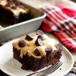 Piece of Chocolate Peanut Butter Poke Cake on plate.