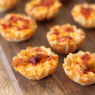 Close up photo of Pimento Cheese Bites on wooden serving board