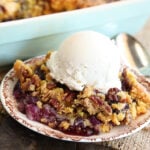 Pineapple Blueberry Dump Cake Served in dish with ice cream on top