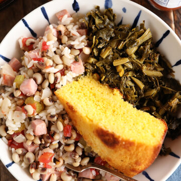 Bolw of Hoppin John, collards, and cornbread.
