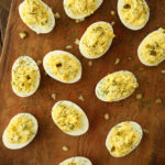 Dill Pickle Deviled Eggs on cutting board