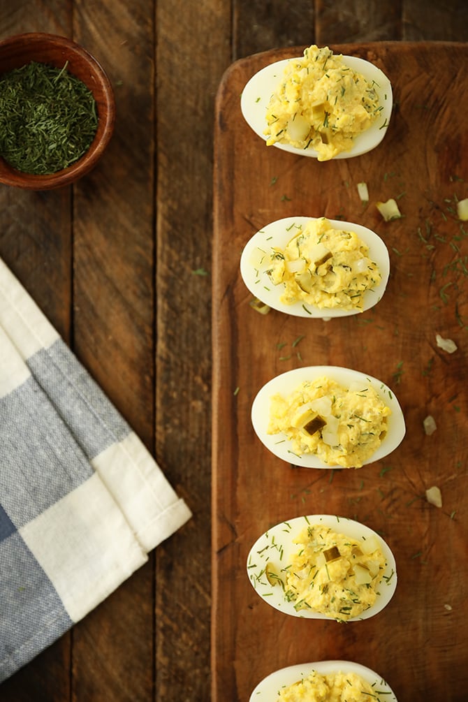 Dill Pickle Deviled Eggs on cutting board