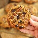 Single Chocolate, Cherry, Pistachio, Pecan Cookie in hand