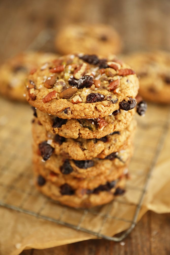 Stack of Chocolate, Cherry, Pistachio, Pecan Cookies on wire rack
