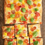 Shortcut Tomato Focaccia on a cutting board.
