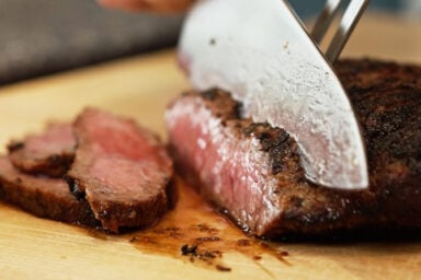 slicing skirt steak against the grain.
