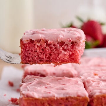 Slice of Strawberry Sheet Cake on server.