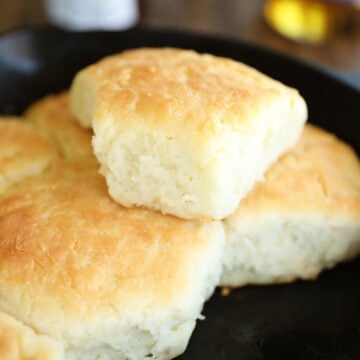 Biscuits in a cast iron skillet.