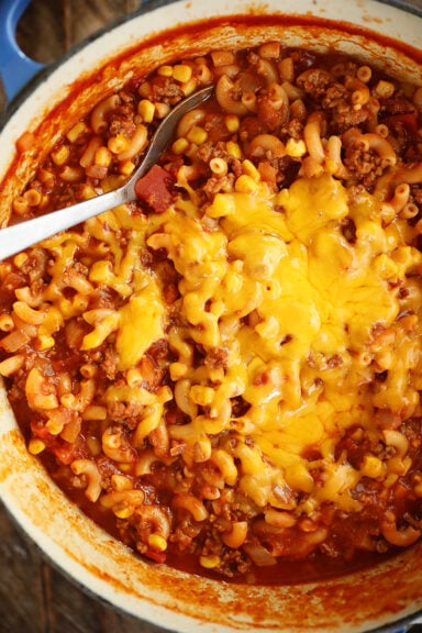 Overhead view of goulash with cheese.