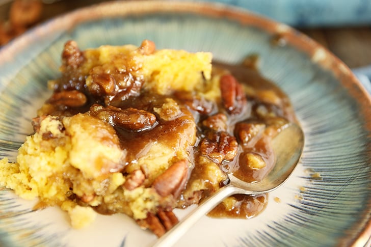 Pecan Pie Cobbler on blue plate.