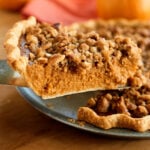 Taking out a piece of Pumpkin Pie.