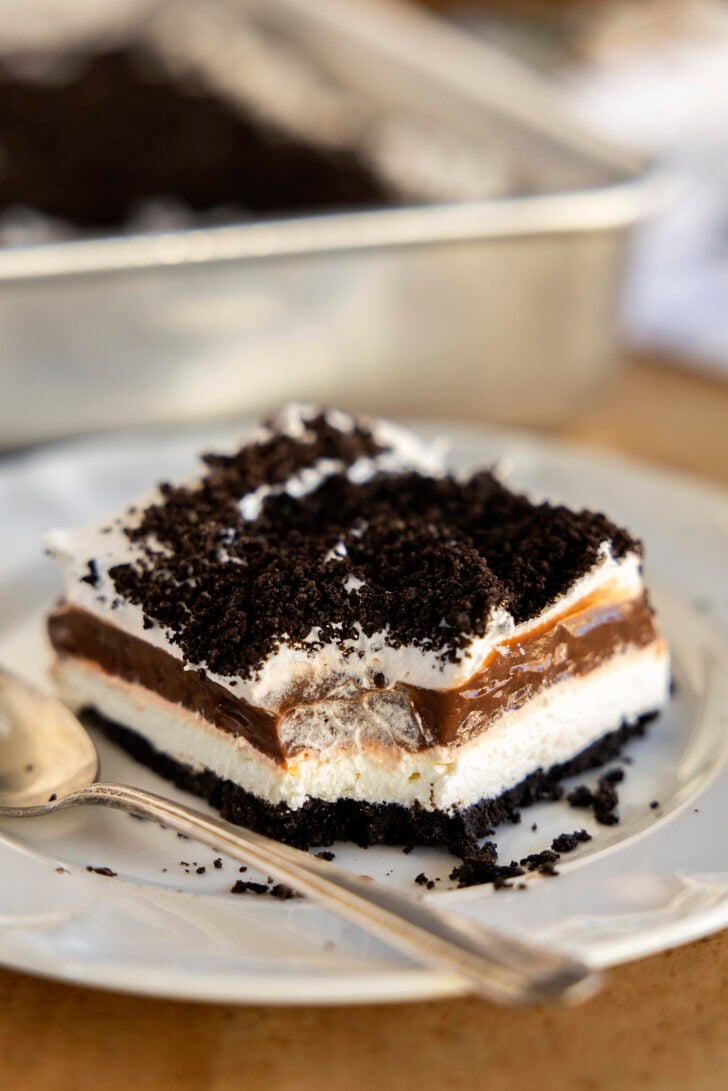 A piece of Oreo Delight with a bite missing.