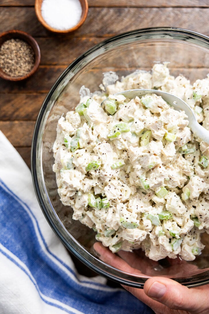 Chicken salad in a clear bowl.